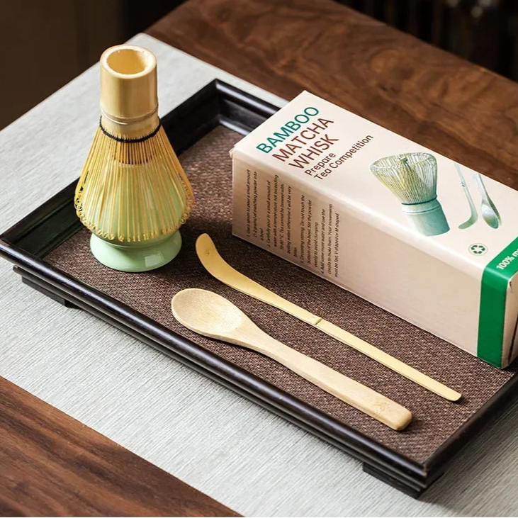 Tea-making set with whisk, spoon, and box on a tray with Wontive branding.