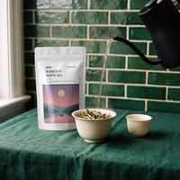 Water poured from a kettle into a gaiwan of Bai Mu Dan white tea